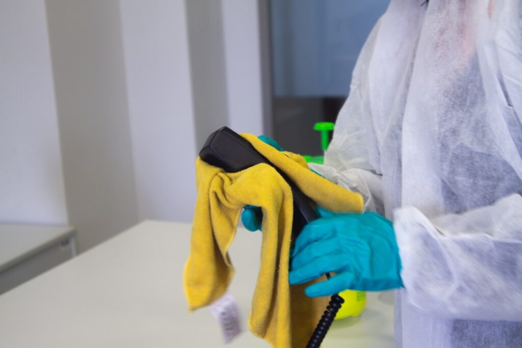 person-in-white-robe-holding-black-and-yellow-umbrella-buxdqh53eis Residential Cleaning
